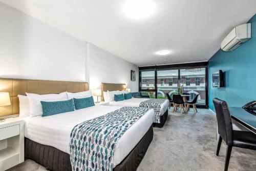 Postel nebo postele na pokoji v ubytování Pegasus Apart-Hotel