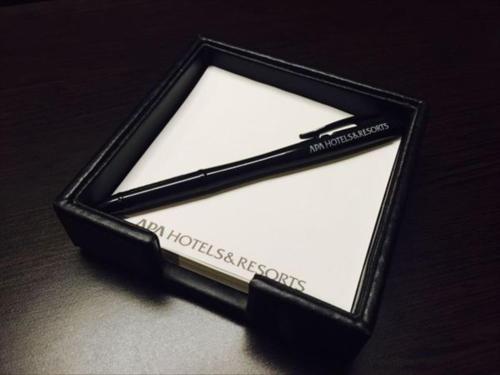 a black and white object sitting on a table at APA Hotel Nambaminami Ebisucho Eki Shinsekai in Osaka