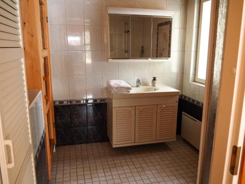 a small bathroom with a sink and a mirror at Koski-Ketola in Kokemäki