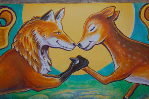 a painting of two horses playing with each other at Hotel Flora and Fauna in Wimberley
