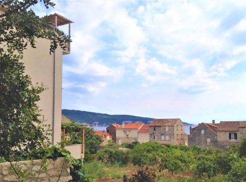 a view of a town from a building at Bed and Breakfast BLUE in BLUE in Komiža
