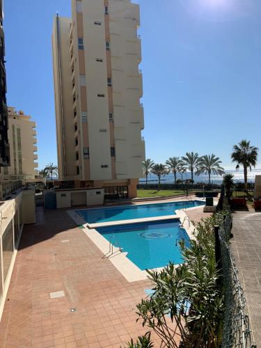 The swimming pool at or near Playa Fontanilla Apartments