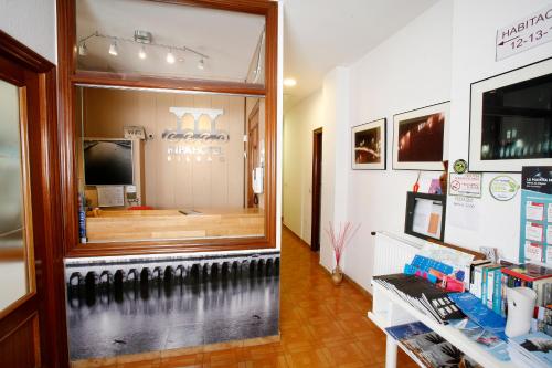 a shop with a large glass window with a gym at Hotel Ripa in Bilbao