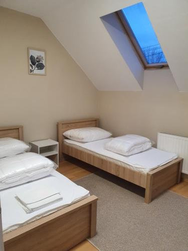A bed or beds in a room at Bella Apartman