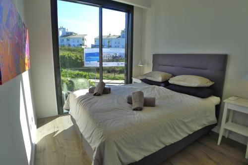 Un pat sau paturi într-o cameră la Nº43 Baviera Golf