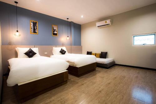 Postel nebo postele na pokoji v ubytování The Sun resort Ratchaburi