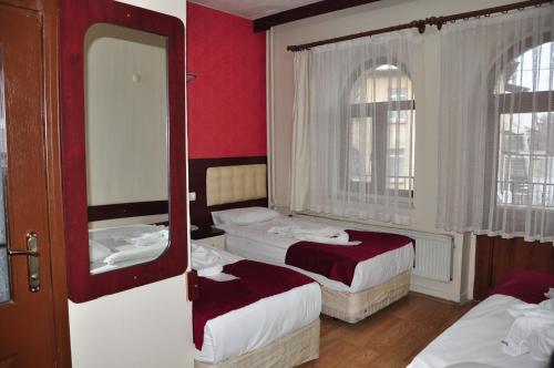 Łóżko lub łóżka w pokoju w obiekcie Sena Hotels