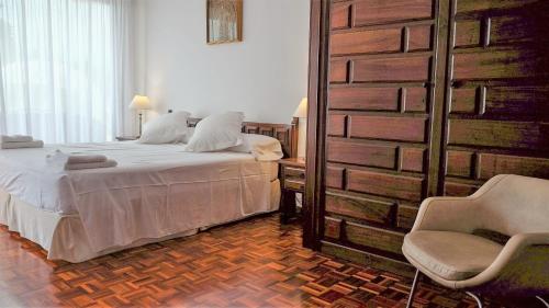 En eller flere senge i et værelse på Casa Vila Reyes