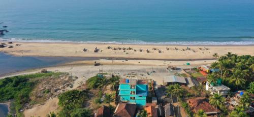 an aerial view of a beach with a group of people at Blue Lagoon Khavane, Tarkarli- Malvan in Vengurla