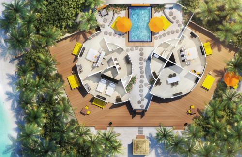 an aerial view of a resort with a pool at Angsana Velavaru in Dhaalu Atoll