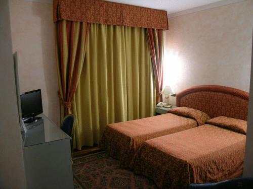 Cama ou camas em um quarto em Hotel Da Vito