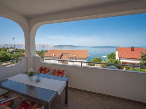 a balcony with a table and a view of the ocean at Apartment Josipa-1 by Interhome in Klenovica