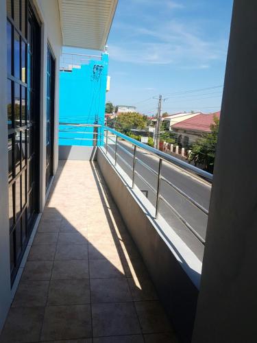 a balcony of a building with a view of a street at Lucky one transient 3mins walk from whart in Alaminos