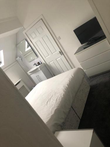 Katil atau katil-katil dalam bilik di Ashfield Hotel