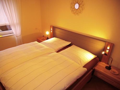 Postel nebo postele na pokoji v ubytování FeWo Sonnenblume