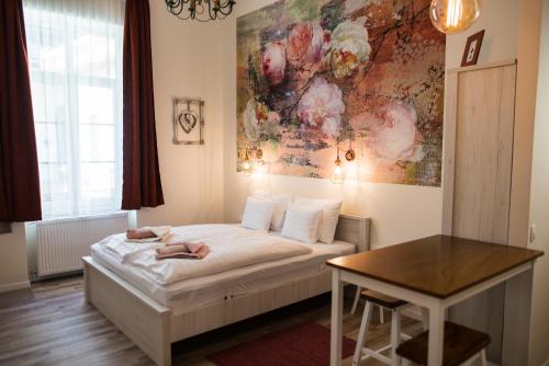 Posteľ alebo postele v izbe v ubytovaní All In Apartman IV.