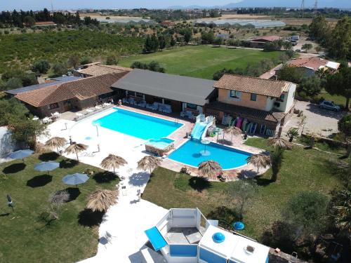 an aerial view of a house with a swimming pool at Riu Sa Murta in Assemini
