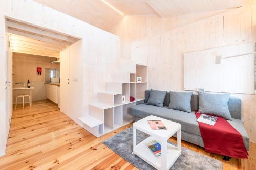 a living room with a couch and a table at GuestReady - Beco do Garcês Apartment in Lisbon