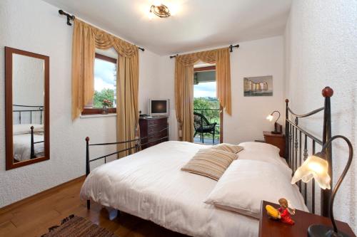 Postel nebo postele na pokoji v ubytování Villa Castello Rausch
