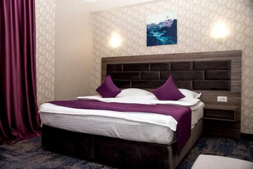 Postel nebo postele na pokoji v ubytování Hotel Yarus
