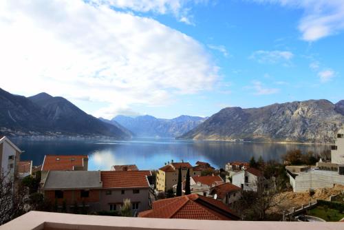 a view of a city and a body of water at Apartments Blue Lagoon in Kotor