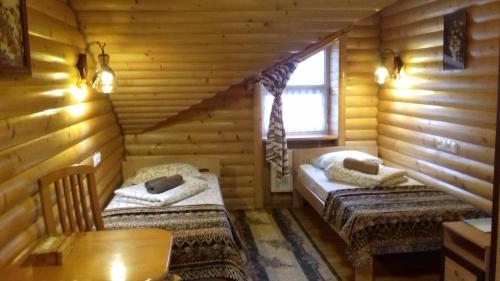 Postel nebo postele na pokoji v ubytování Guest House U Sester