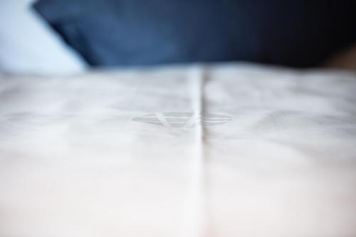 a close up of a table with a glass of water at Hotel Frauenfeld in Frauenfeld