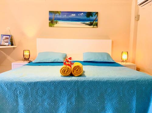 En eller flere senge i et værelse på Aruba Sunset Beach Studios