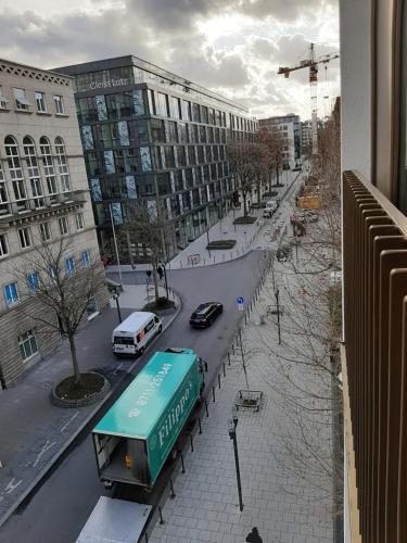 a view of a street with a truck on the road at Hochwertig im Herzen Stuttgarts in Stuttgart