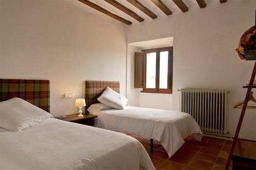 Un pat sau paturi într-o cameră la Casa rural Casa Fuerte San Gregorio I