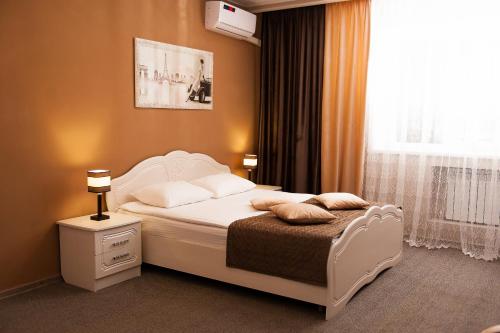 Кровать или кровати в номере Гостиница Белая Акация