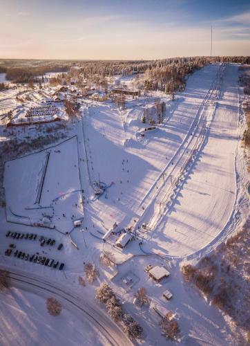an aerial view of a snow covered street with a road at Hotelli Messilä in Lahti