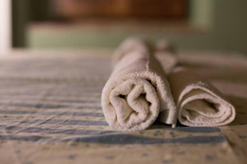 a towel sitting on top of a wooden table at Agriturismo Casariccio - Casa Viola in Bucine