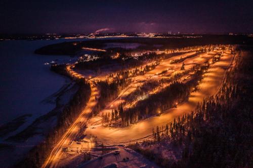 an aerial view of a river at night at Hotelli Messilä in Lahti