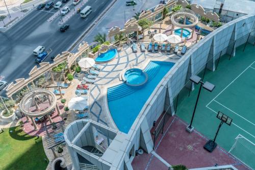 an overhead view of a pool at a resort at Lux BnB Studio Park Tower DIFC in Dubai