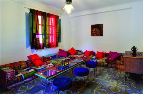 a living room with a couch and a table at La Boutique in Nuévalos
