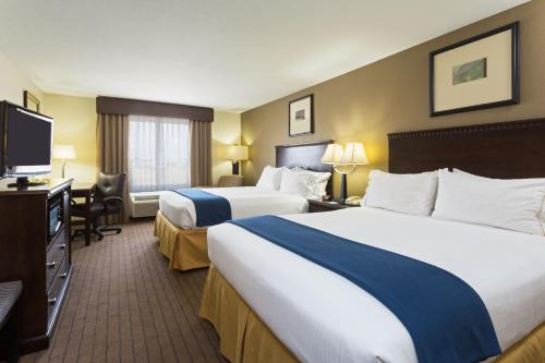a hotel room with two beds and a flat screen tv at Holiday Inn Express & Suites Moultrie, an IHG Hotel in Moultrie