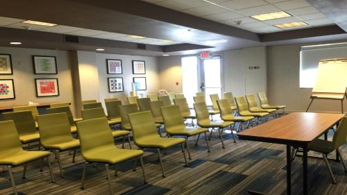 a conference room with chairs and a table and a chalkboard at Holiday Inn Express Woodland by IHG in Woodland