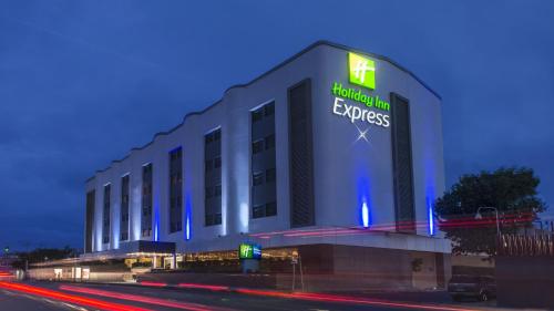 a building with a sign on the side of it at Holiday Inn Express Mexico- Toreo by IHG in Mexico City