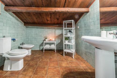 a bathroom with two toilets and a sink at Design Apartments Sassari-Skyline in Sassari