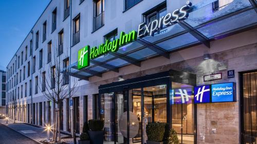 a store front of a building with a sign on it at Holiday Inn Express Munich - City East by IHG in Munich