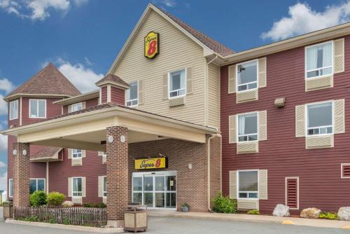 a fast food restaurant with a sign on the front of it at Super 8 by Wyndham Windsor NS in Windsor