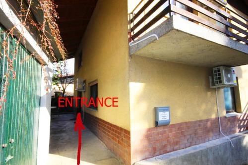 an image of an entrance to a building with a red ribbon at Na Kopitarjevi in Laško