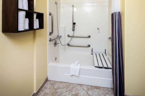 a bathroom with a white tub and a shower at La Quinta by Wyndham Inglewood in Inglewood