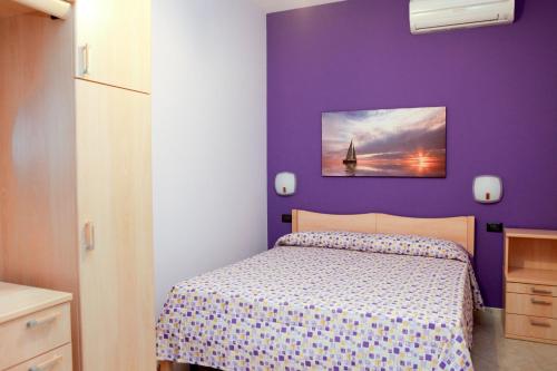 Il Corallo casa vacanze tesisinde bir odada yatak veya yataklar