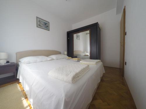 Tempat tidur dalam kamar di Vila Ruža