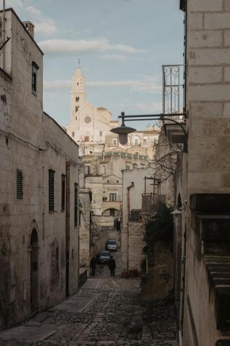 an alley in an old town with a building at LUX LUCIS in Matera