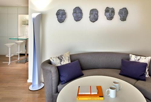a living room with a couch and a table at Mondrian Los Angeles in Los Angeles