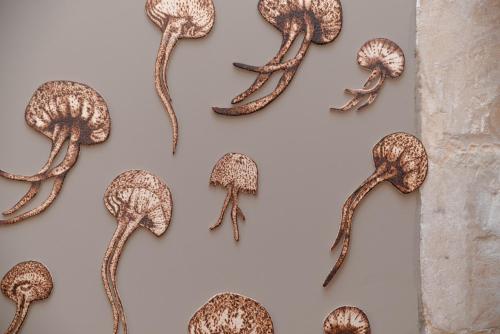a bunch of mushrooms hanging on a wall at Litium 3 in Lecce