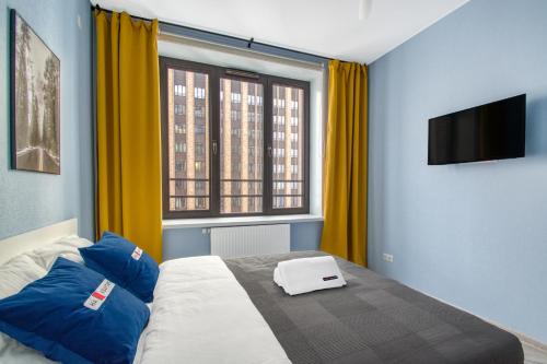 
A bed or beds in a room at New Apartments at Savelovsky City

